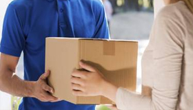 In this image you can see a man delivering a product at door by The Express Cargo Packers and movers in Delhi.